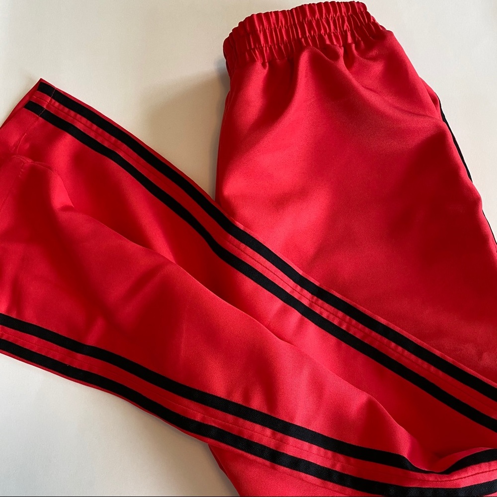 red joggers with black stripes
